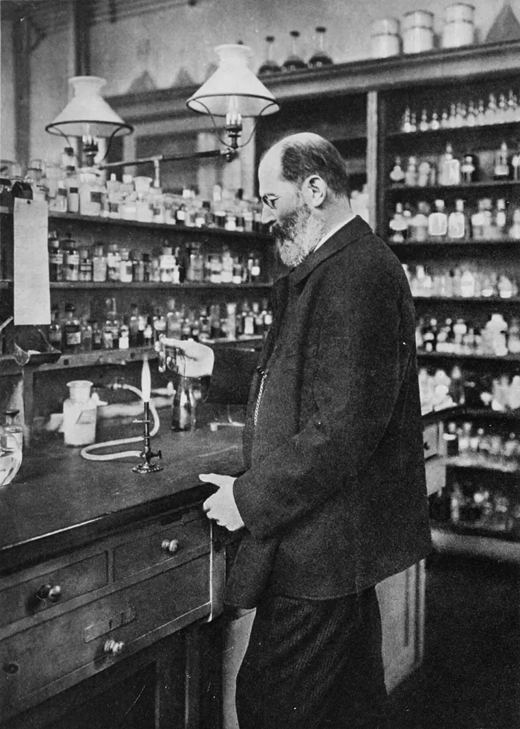 Emil Fischer standing in his private laboratory in Berlin, surrounded by flasks